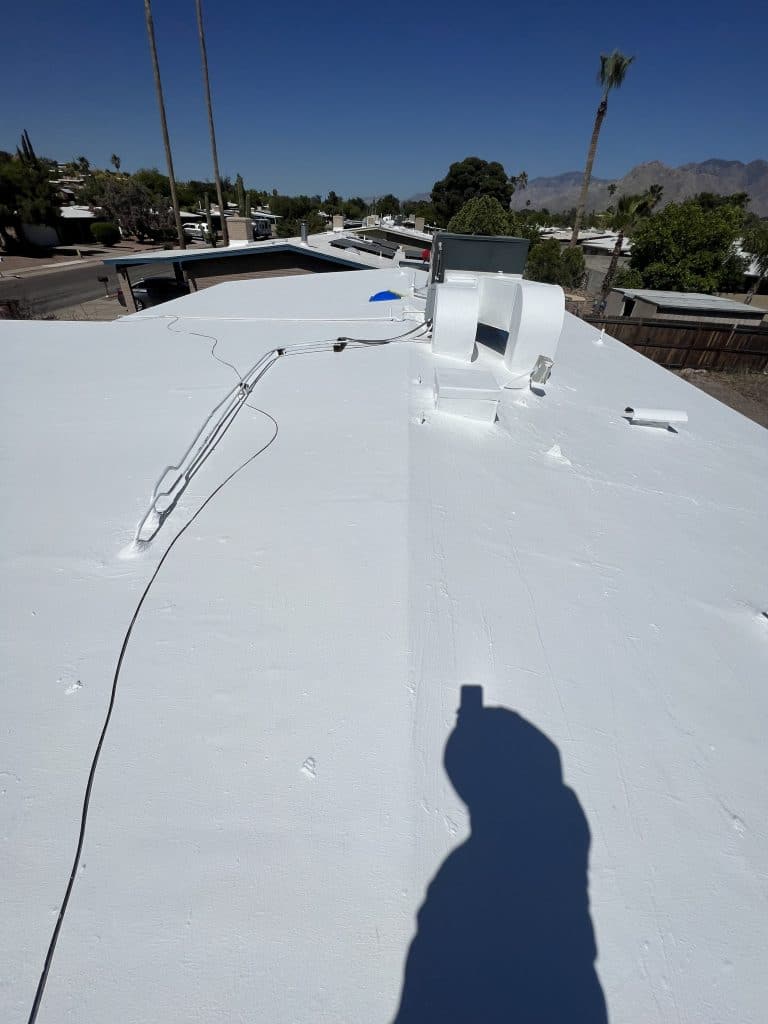 Expertly applied white roof coating by Roofing Pros Az. Our coatings enhance energy efficiency and extend the life of your roof in the Arizona heat scaled