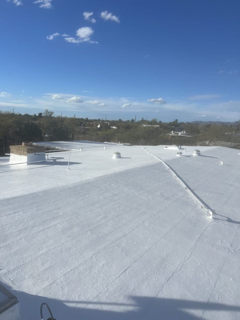 Seamless white roof coating by Roofing Pros Az. Our high quality coatings enhance energy efficiency and protect your home from the elements scaled